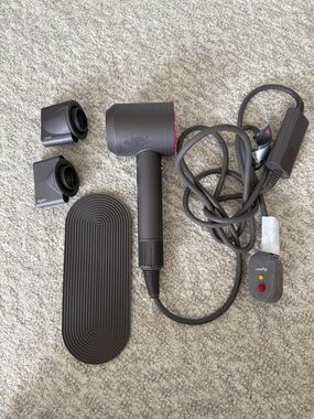 Dyson Hair Dryer in Charcoal with Pink Accent and Magnetic Nozzles